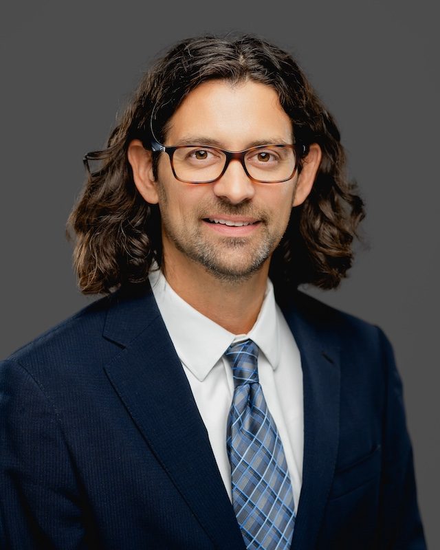 Todd Hartzler wearing a suit and tie